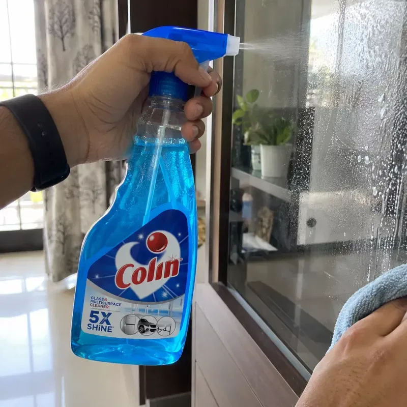Colin Glass and Surface Cleaner (500 ml spray) Colin glass cleaner sprayed on a glass cabinet door