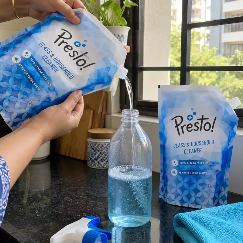 Presto! Glass & Household Cleaner (2 × 1 L refill) Presto glass and household cleaner refill poured into a spray bottle